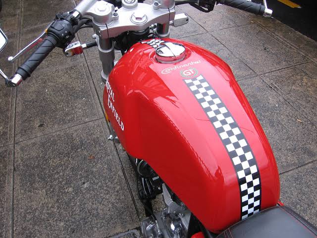 Dual colored tank stripe sticker on continental GT red bike